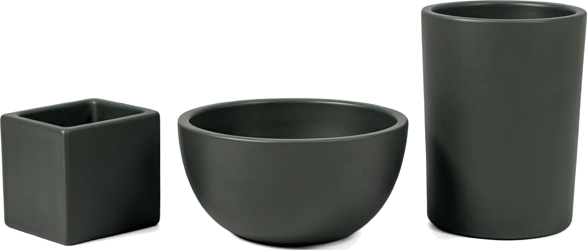 An empty charcoal cube, low bowl and tall cylinder side by side