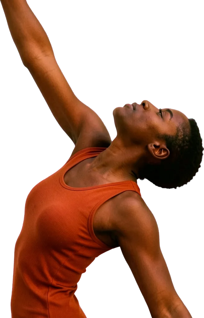 A dancer in an orange top arching back, one arm reaching up