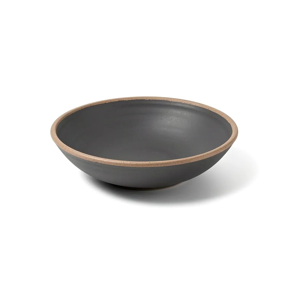 A wide charcoal stoneware bowl with a raw clay rim
