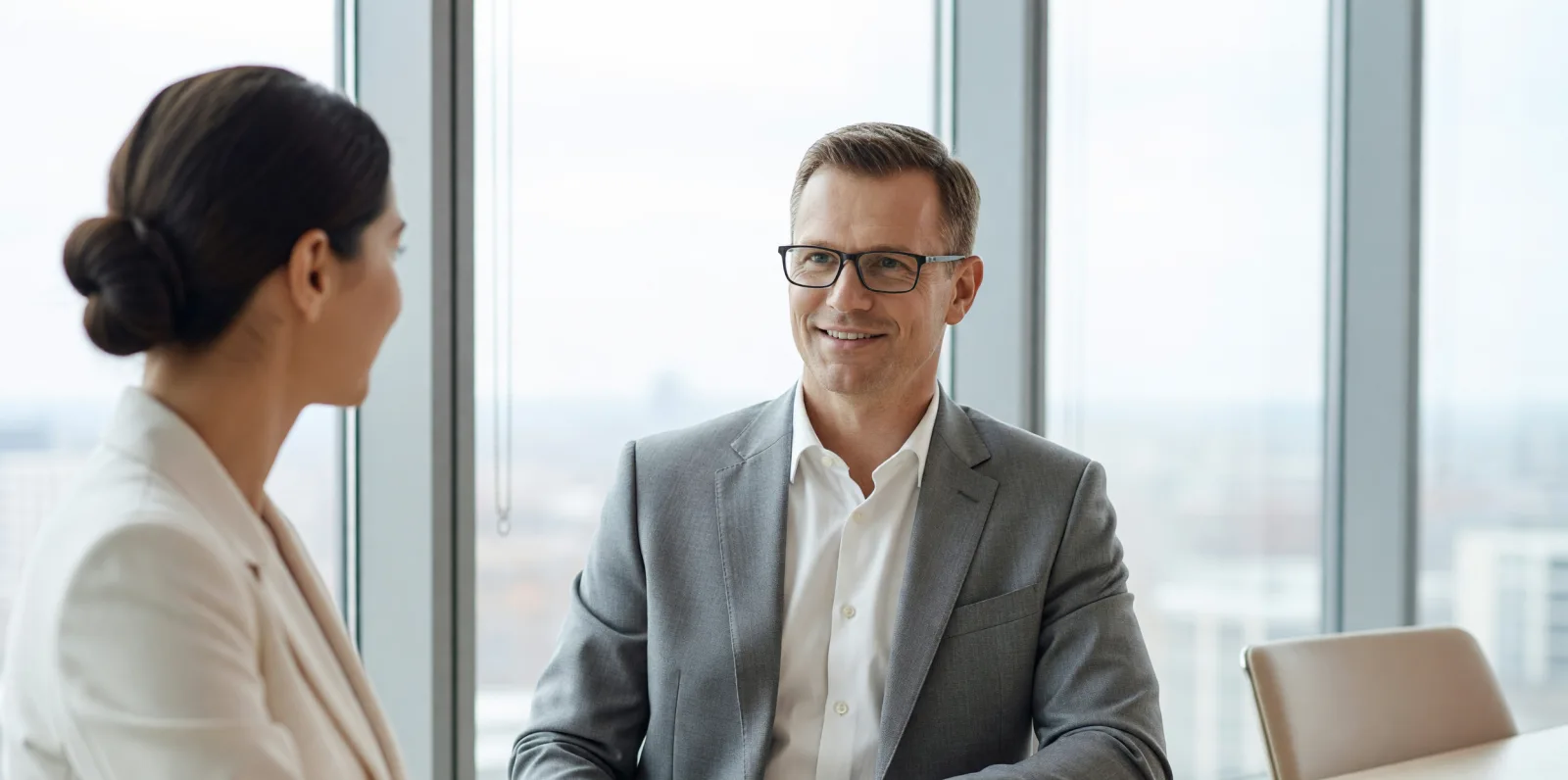 An advisor talking a client through the diagnostic by the window