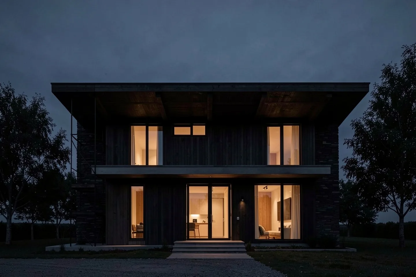 A dark timber house at blue hour, its windows lit