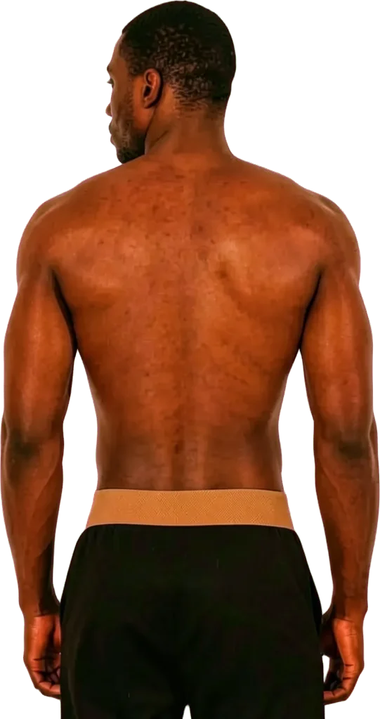 A dancer seen from behind, arms at his sides